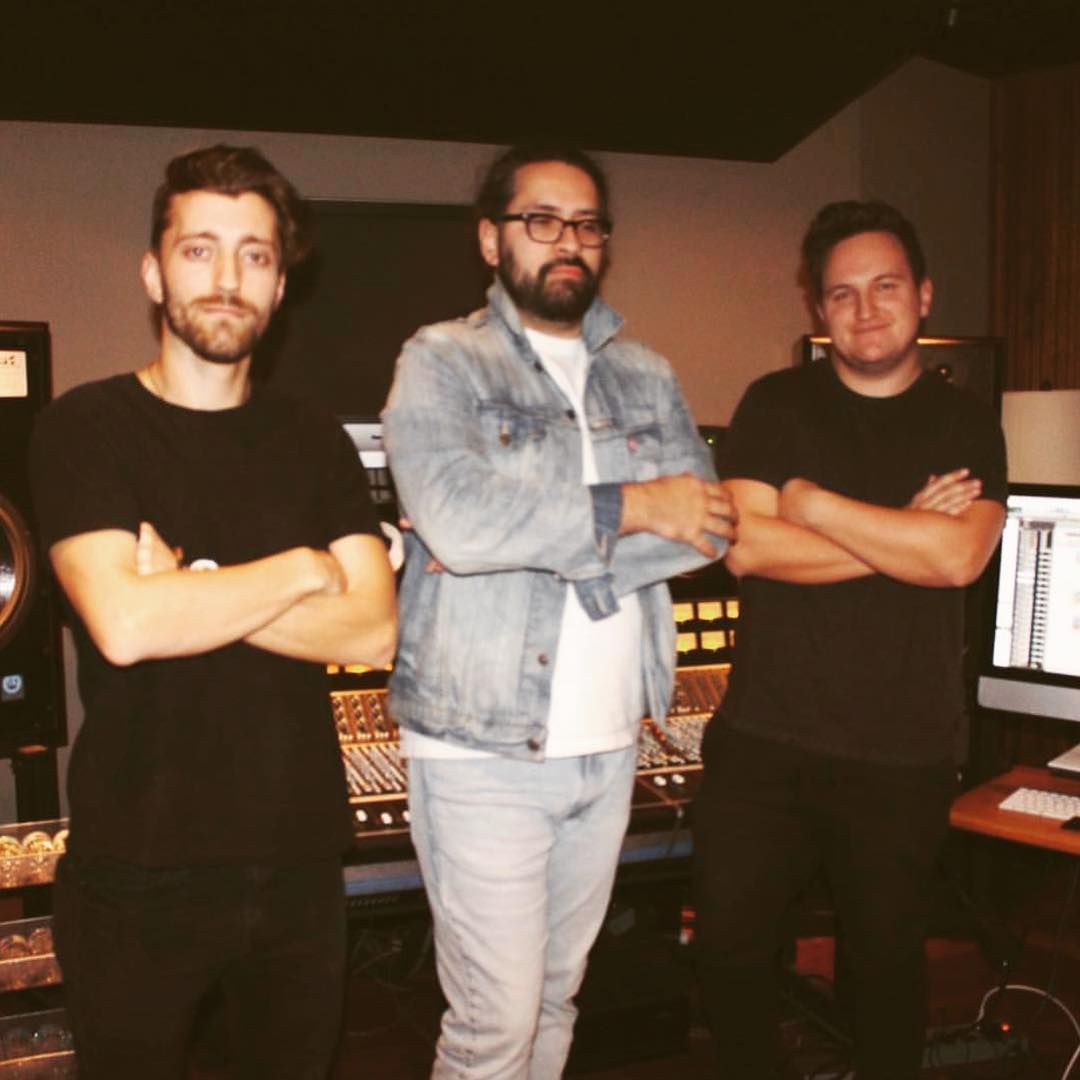 Three Audio Engineers standing at the console at Blackbird Studios in Nashville Tennessee